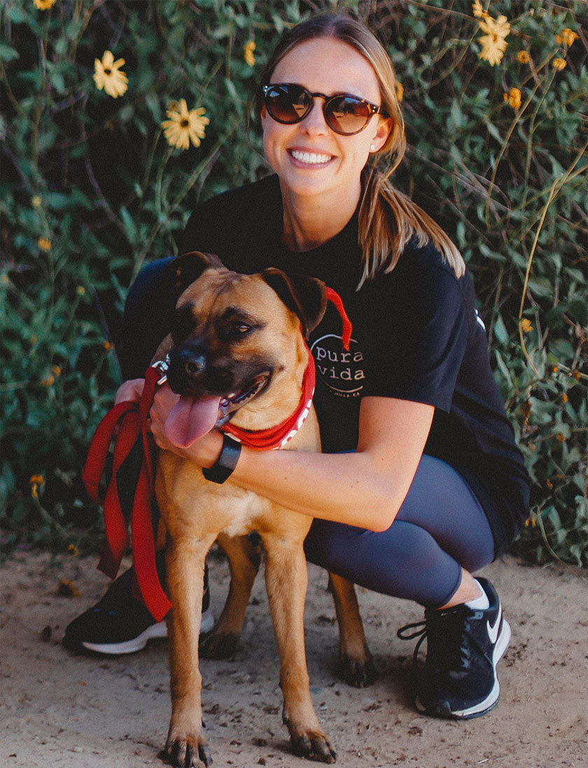 Photo of Kristy Ryan with a dog from the Barking Lot