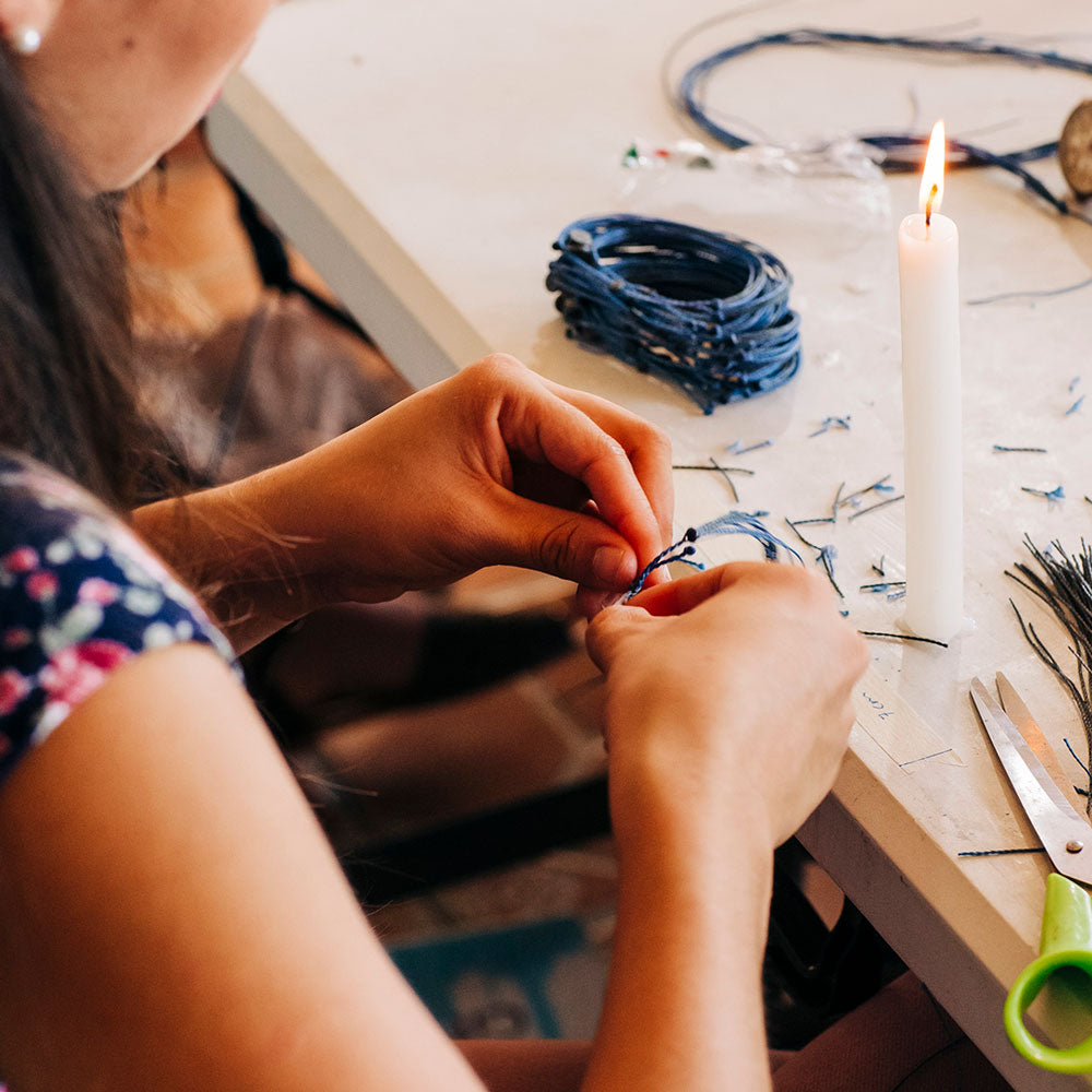 Artisan creating a bracelet