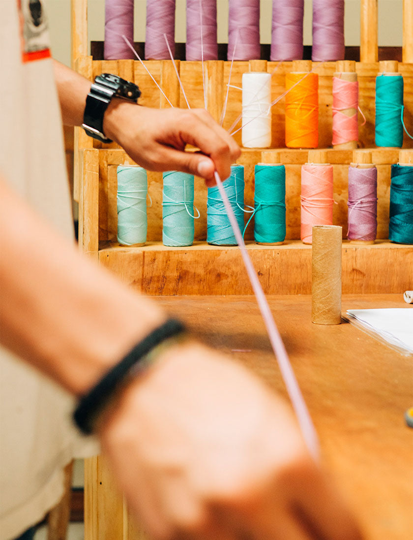 Artisan with bracelet string